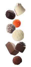 Image of Different chocolate candies falling on white background