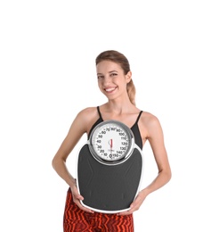 Photo of Young beautiful woman with scales on white background. Weight loss motivation