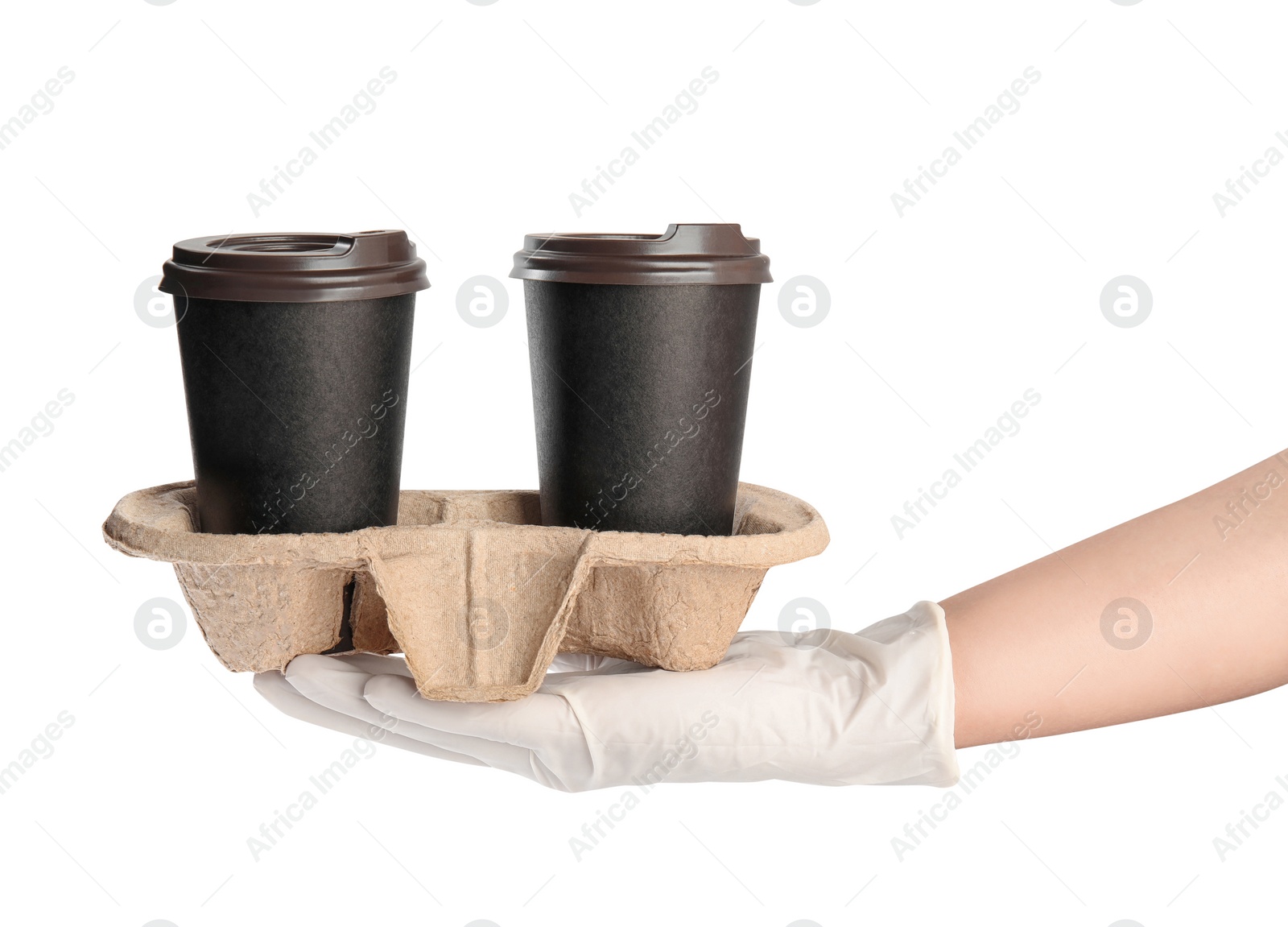 Photo of Woman holding cardboard holder with takeaway paper coffee cups on white background, closeup