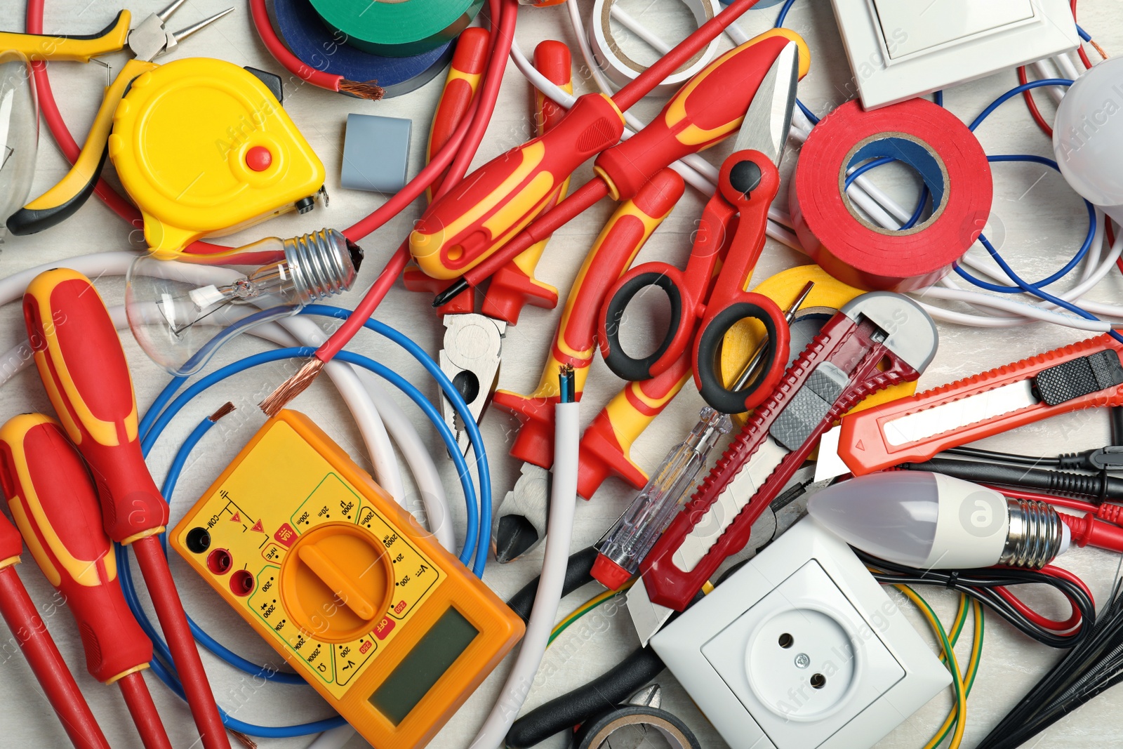 Photo of Set of electrician's tools on table, top view