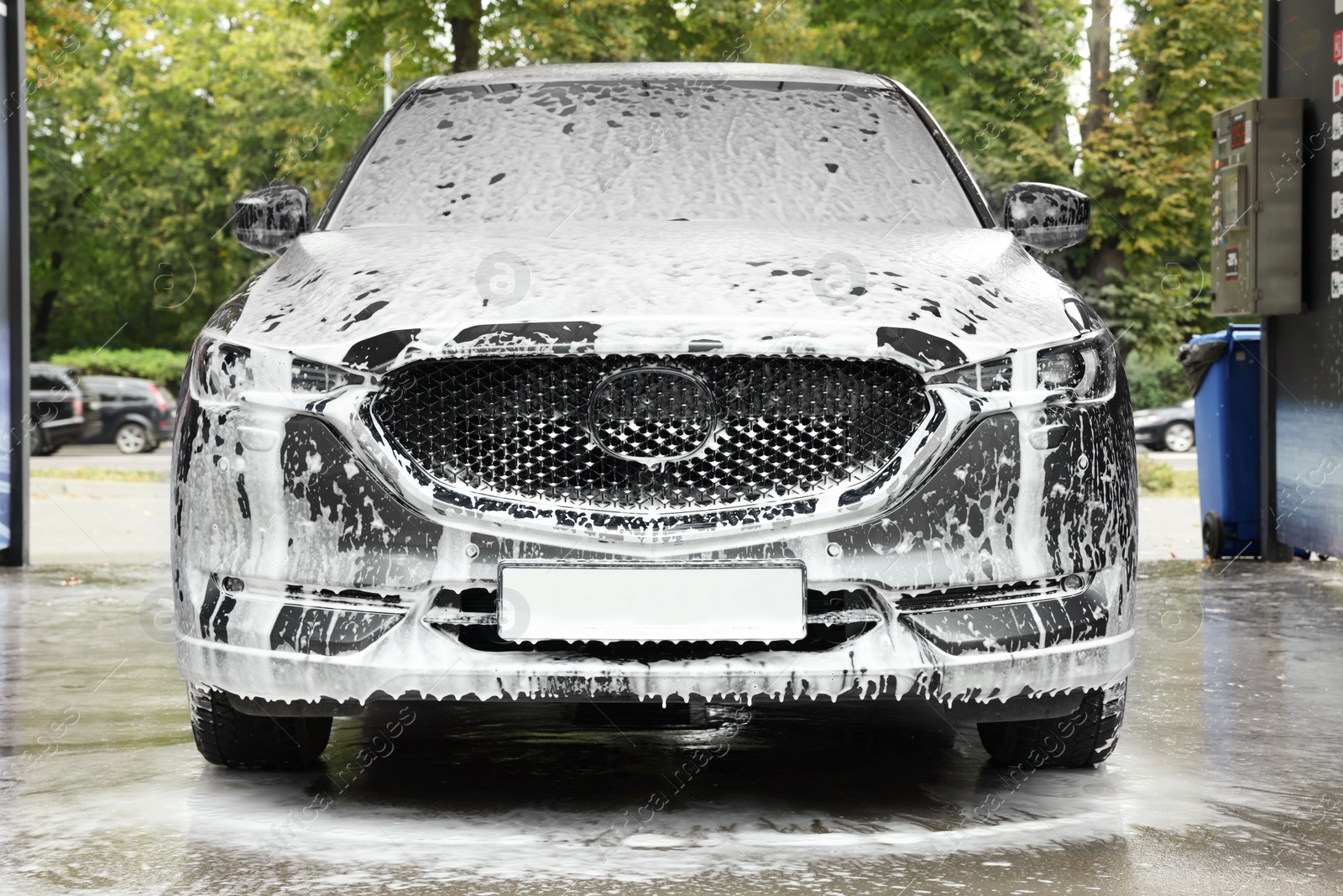 Photo of Auto with cleaning foam at car wash