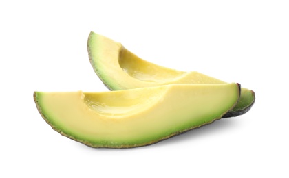 Slices of ripe avocado on white background