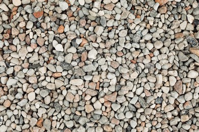 Pile of grey stones as background, top view