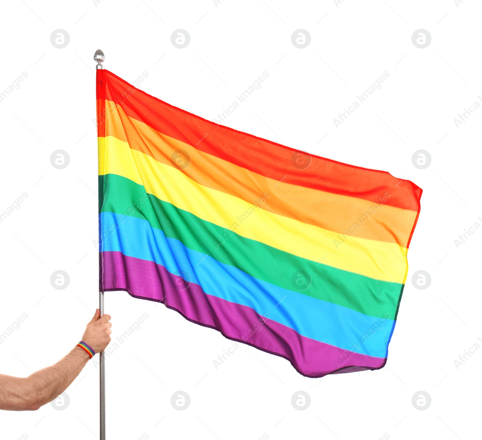 Photo of Gay man holding rainbow LGBT flag on white background