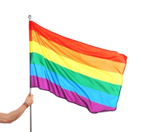 Photo of Gay man holding rainbow LGBT flag on white background