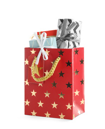 Photo of Shopping paper bag with presents isolated on white