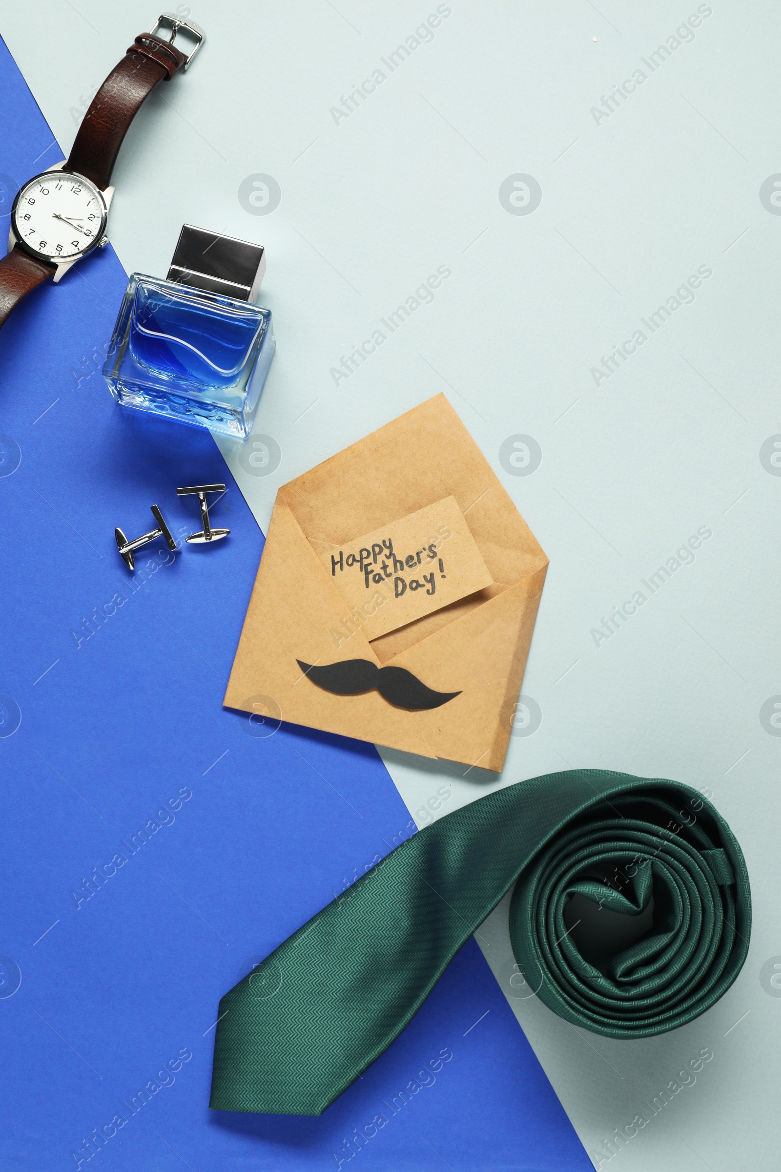 Photo of Card with phrase Happy Father's Day and different men accessories on color background, flat lay