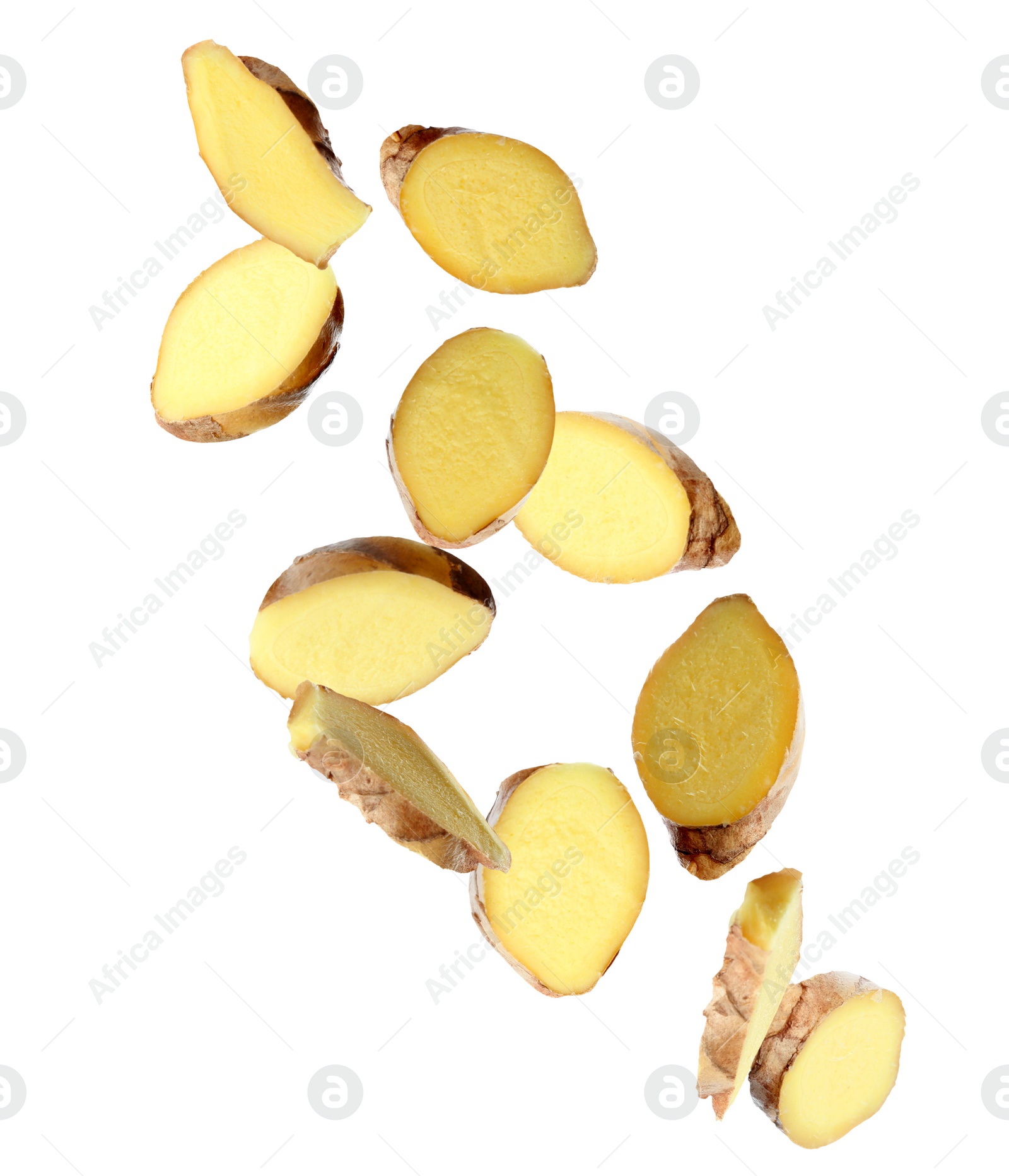 Image of Fresh sliced ginger falling on white background