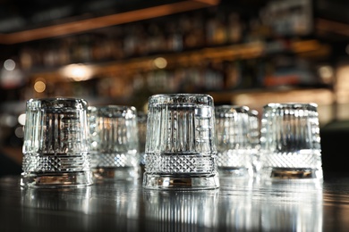 Empty clean glasses on counter in modern bar