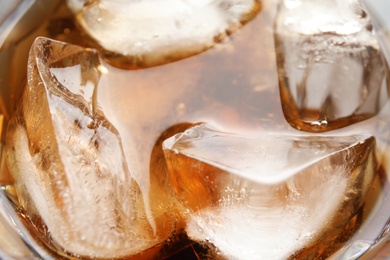 Photo of Refreshing drink with ice cubes, closeup view