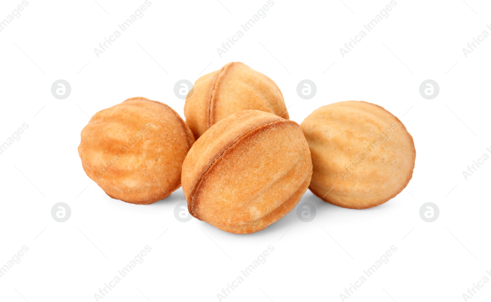 Photo of Delicious nut shaped cookies with condensed milk on white background