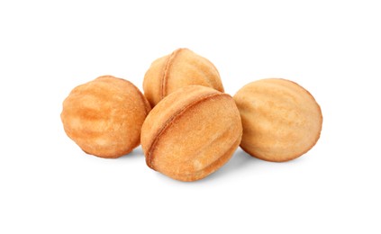 Photo of Delicious nut shaped cookies with condensed milk on white background