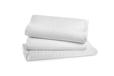 Photo of Clean soft orthopedic pillows on white background