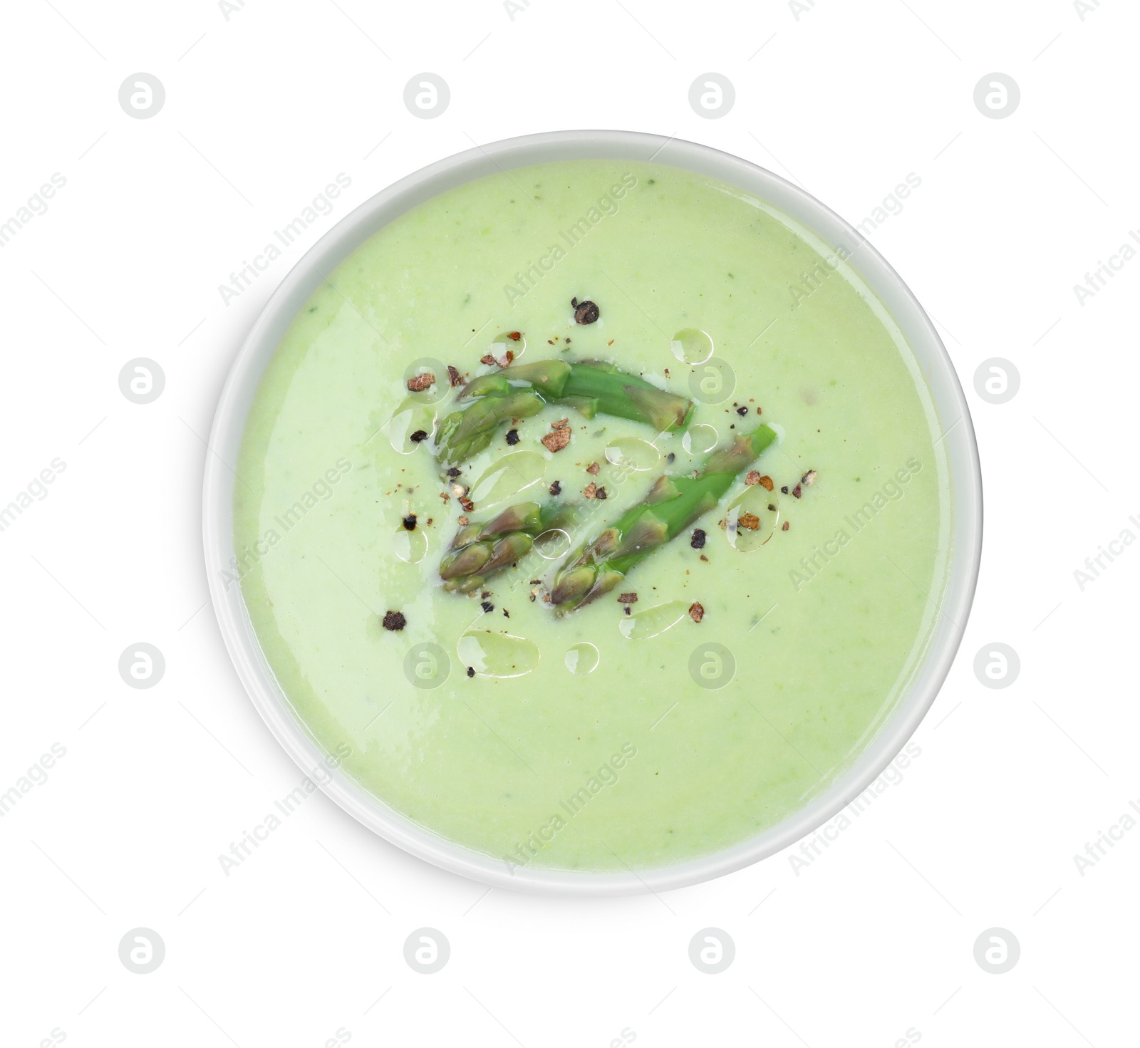 Photo of Delicious asparagus soup with spices on white background, top view