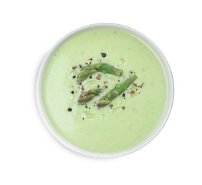 Delicious asparagus soup with spices on white background, top view