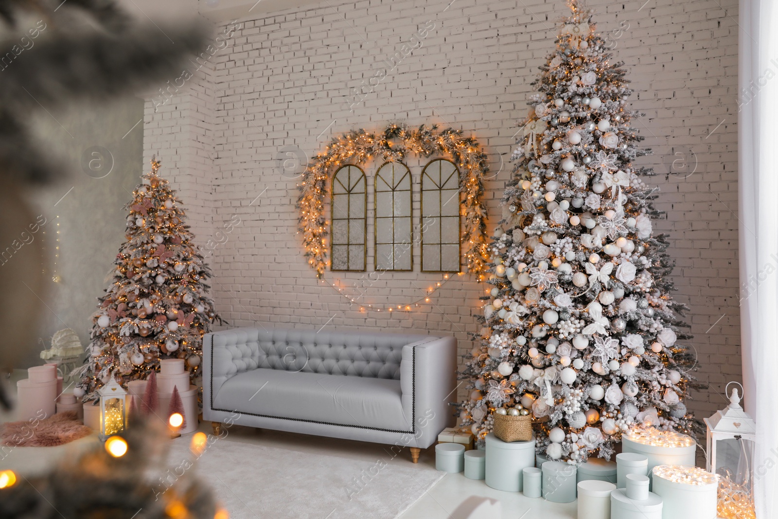 Photo of Beautiful interior of living room with decorated Christmas trees