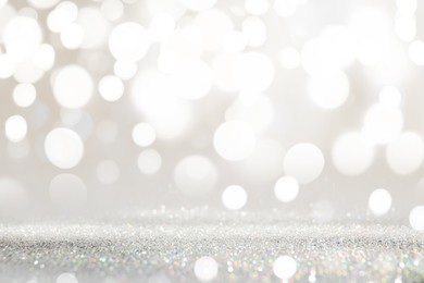 Image of Shiny silver glitter as background. Bokeh effect