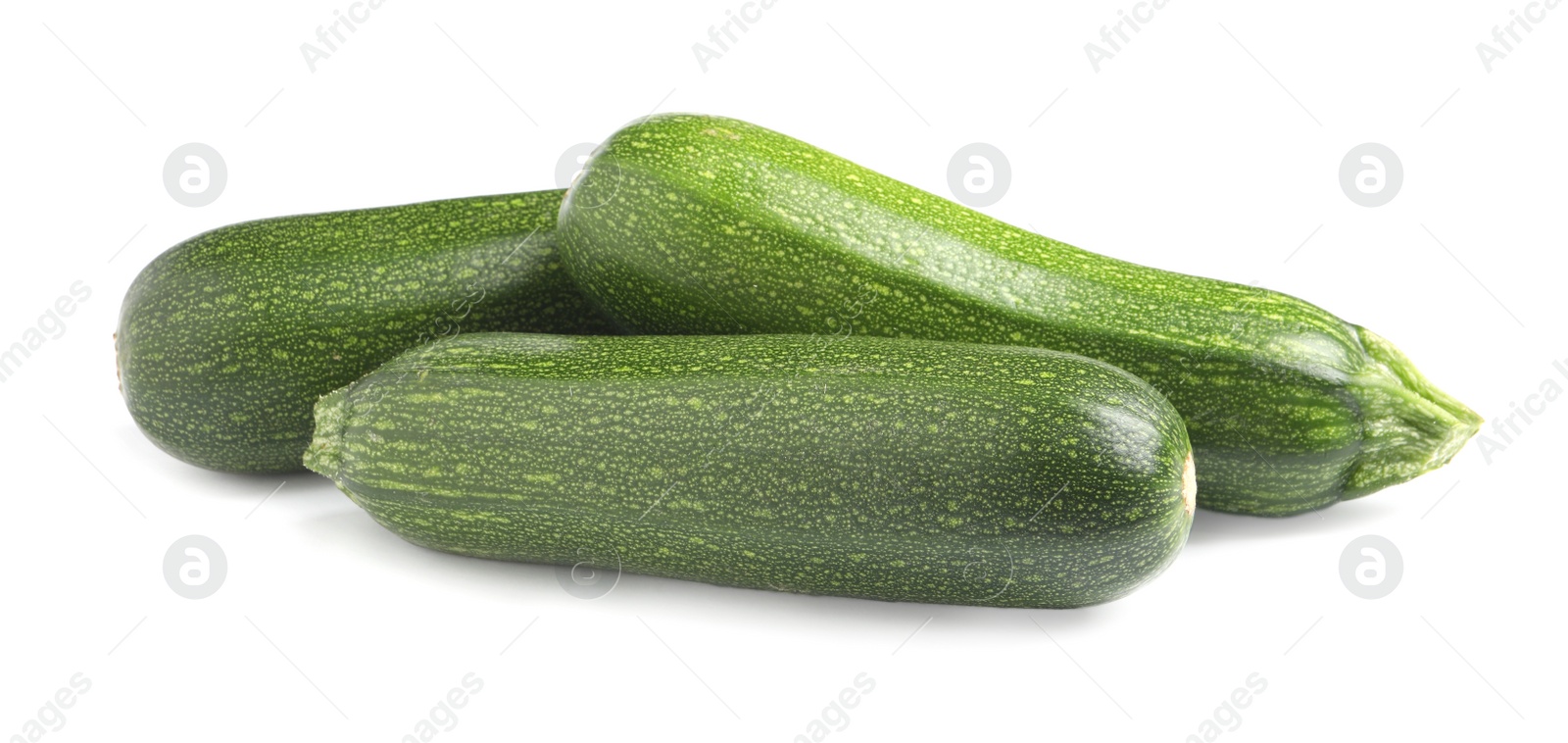 Photo of Fresh raw ripe zucchinis on white background