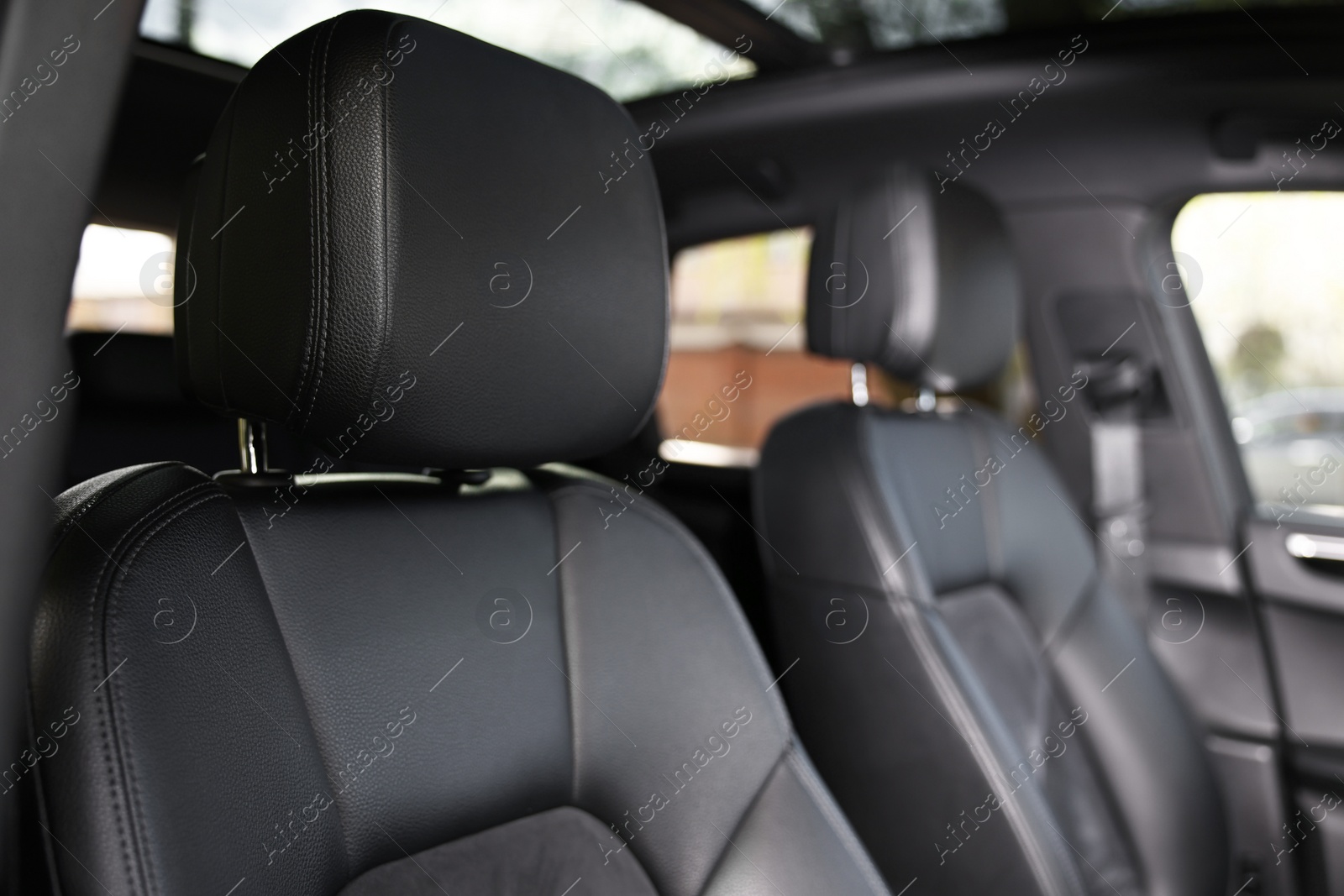 Photo of Seats inside of modern black car, closeup view