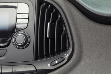 Photo of Modern air conditioning control panel in car, closeup