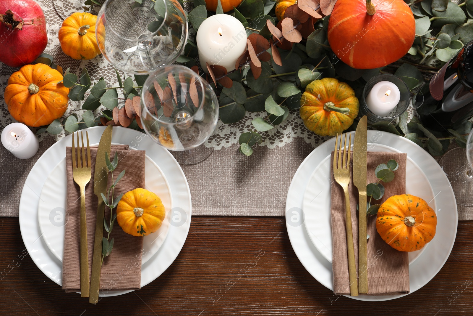 Photo of Beautiful autumn table setting. Plates, cutlery, glasses, pumpkins and floral decor, flat lay