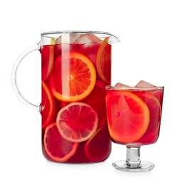 Photo of Glass and jug of Red Sangria isolated on white