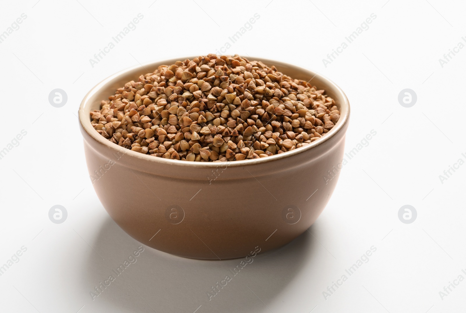 Photo of Bowl with buckwheat on white background. Natural food high in protein