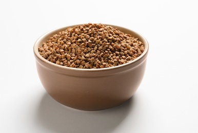 Bowl with buckwheat on white background. Natural food high in protein