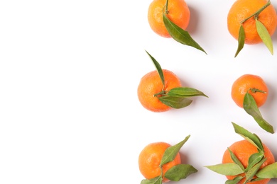 Flat lay composition with ripe tangerines on white background. Space for text