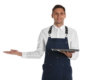 Photo of Portrait of happy young waiter with tray on white background