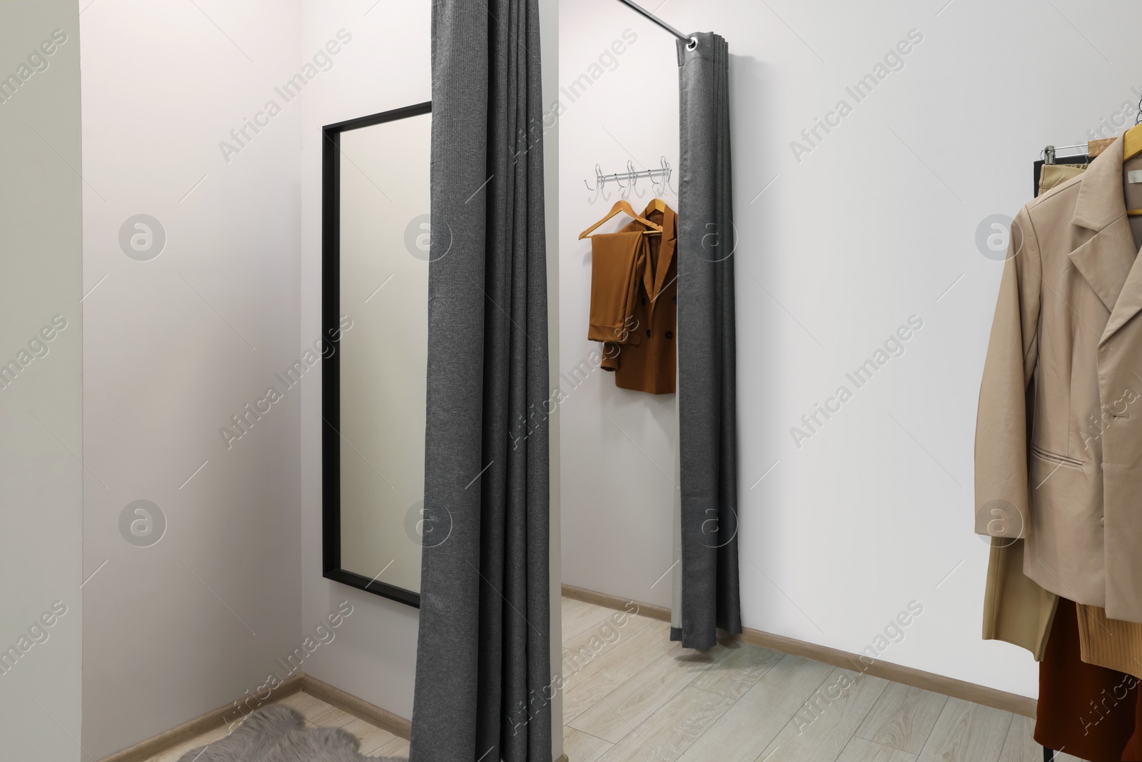 Photo of Dressing rooms in fashion store. Interior design