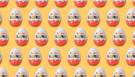Mykolaiv, Ukraine - June 26, 2023: Kinder Surprise Egg on yellow background, seamless pattern design