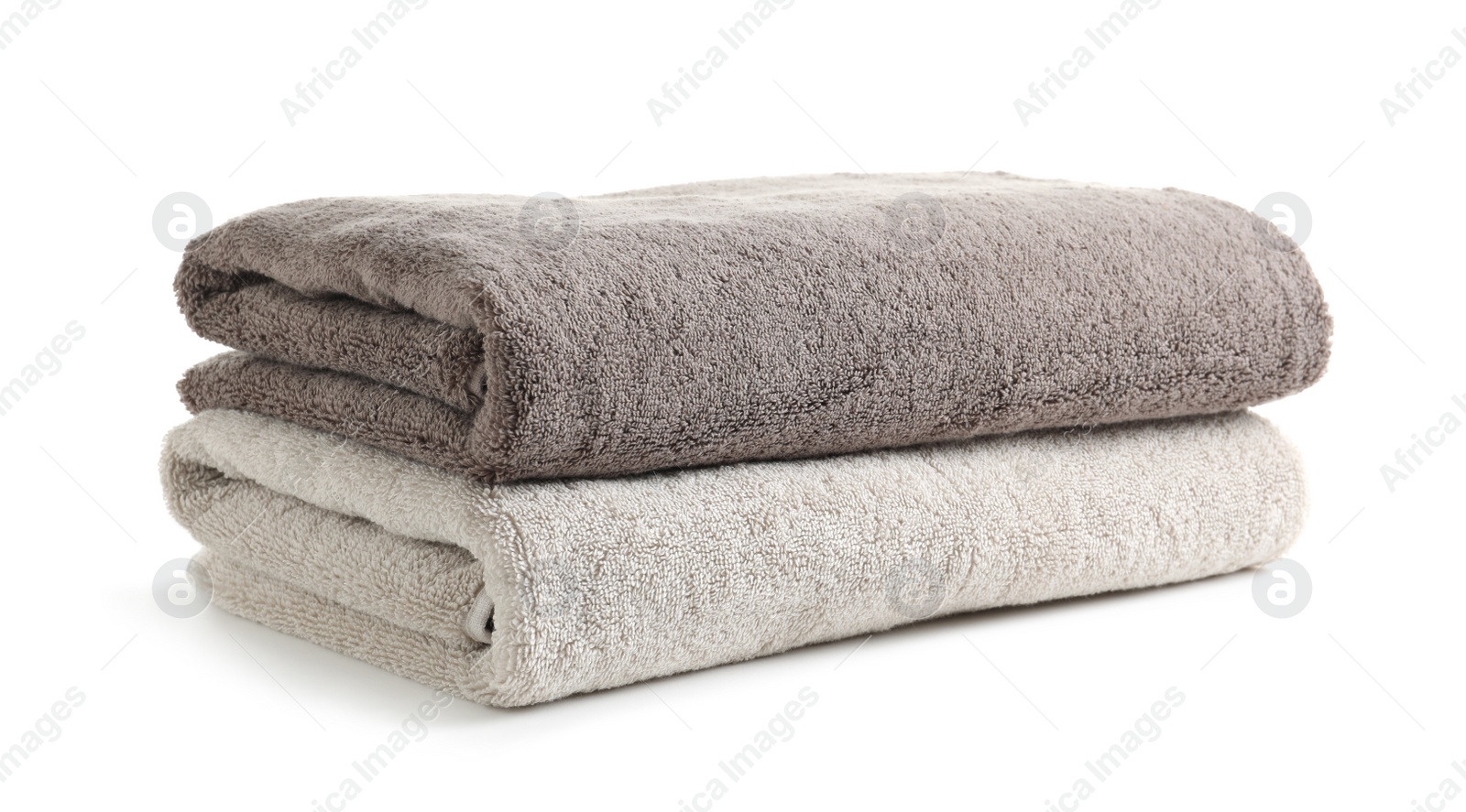 Photo of Fresh soft folded towels isolated on white