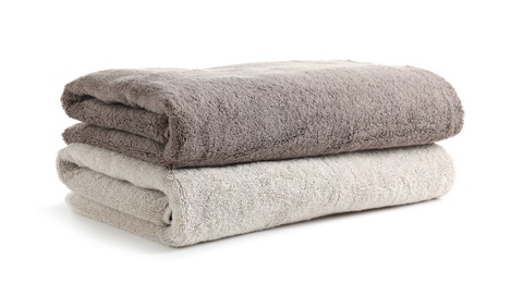 Photo of Fresh soft folded towels isolated on white