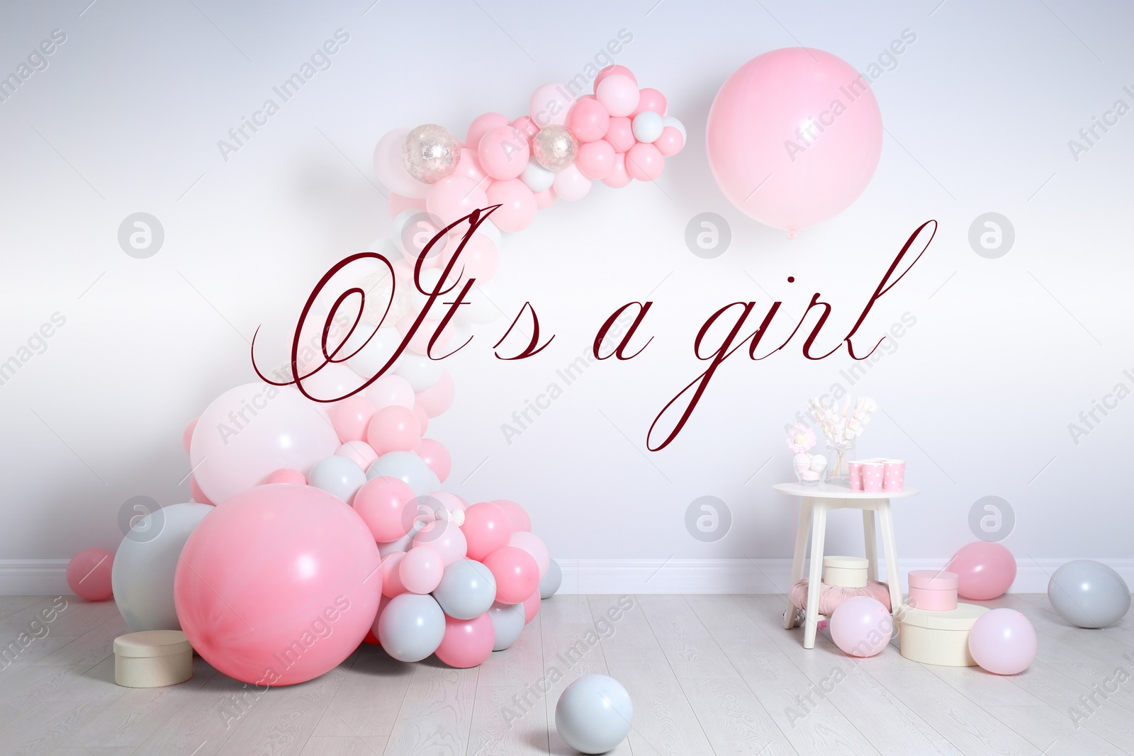 Image of Baby shower party for girl. Balloons and sweets in room 