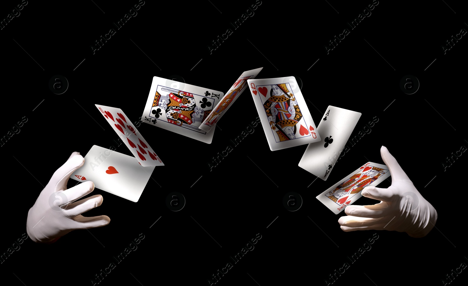 Image of Magician performing card trick on black background, closeup