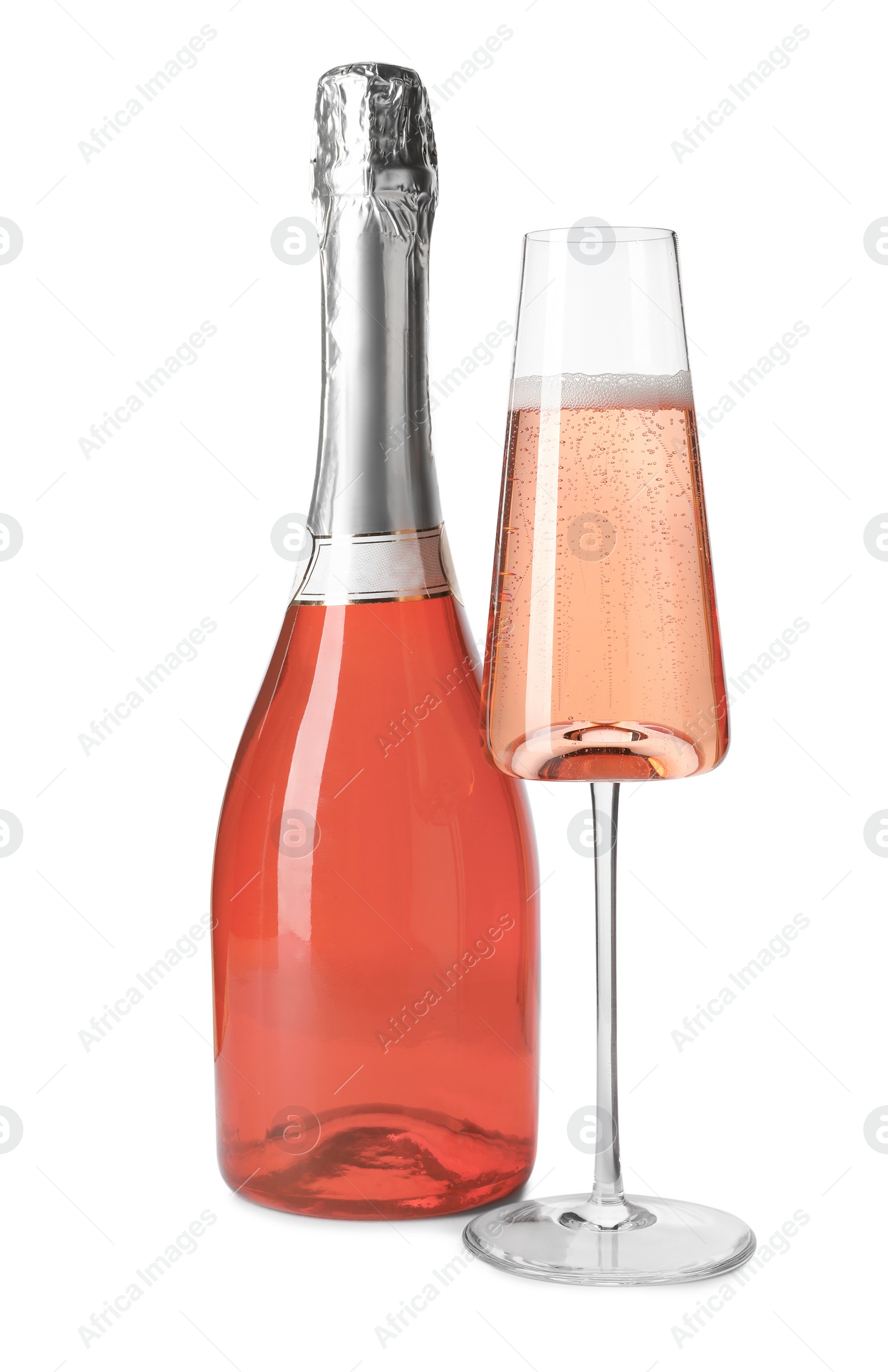 Photo of Bottle and glass of rose champagne isolated on white. Mockup for design