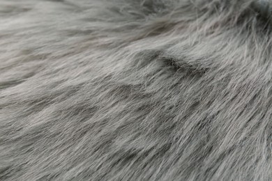 Photo of Grey faux fur as background, closeup view