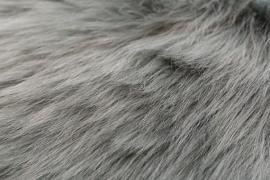 Grey faux fur as background, closeup view