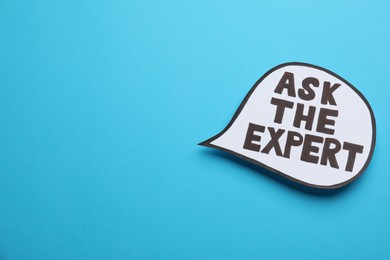 Photo of Speech bubble sticker with phrase Ask The Expert on light blue background. Space for text