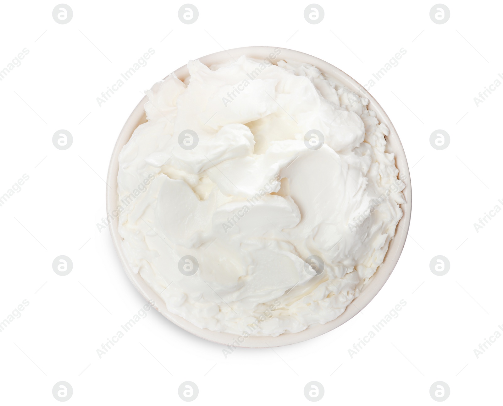 Photo of Bowl of tasty cream cheese isolated on white, top view