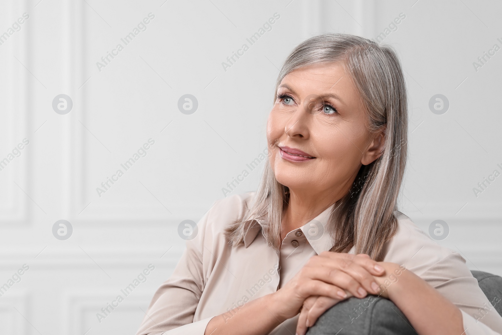 Photo of Portrait of beautiful senior woman indoors. Space for text