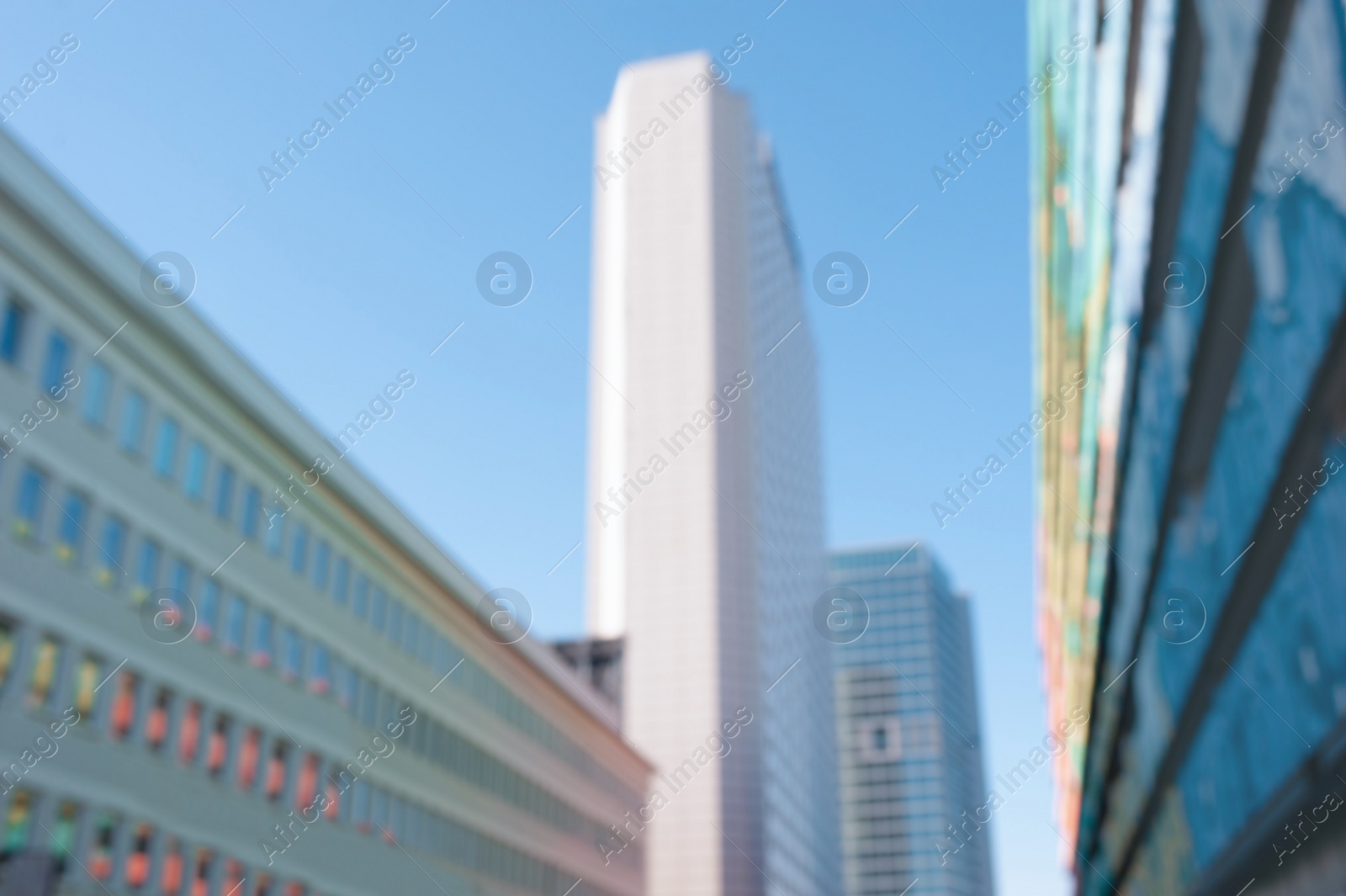 Photo of Blurred view of modern buildings on sunny day