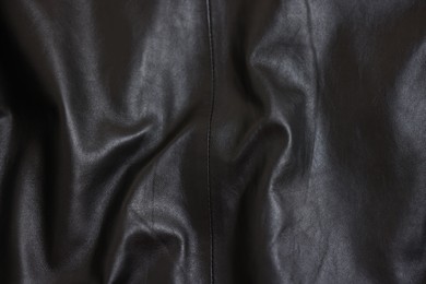 Photo of Texture of crumpled black leather as background, top view