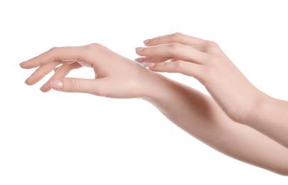 Photo of Woman applying cream on her hand against white background, closeup