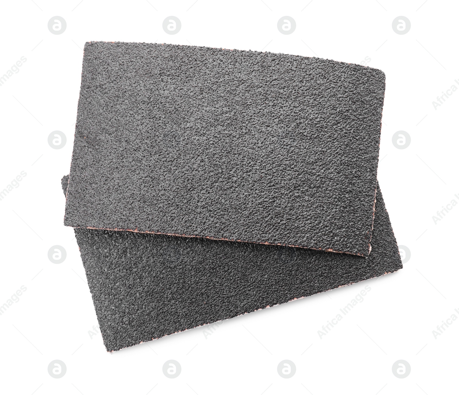 Photo of Two sheets of sandpaper isolated on white, top view