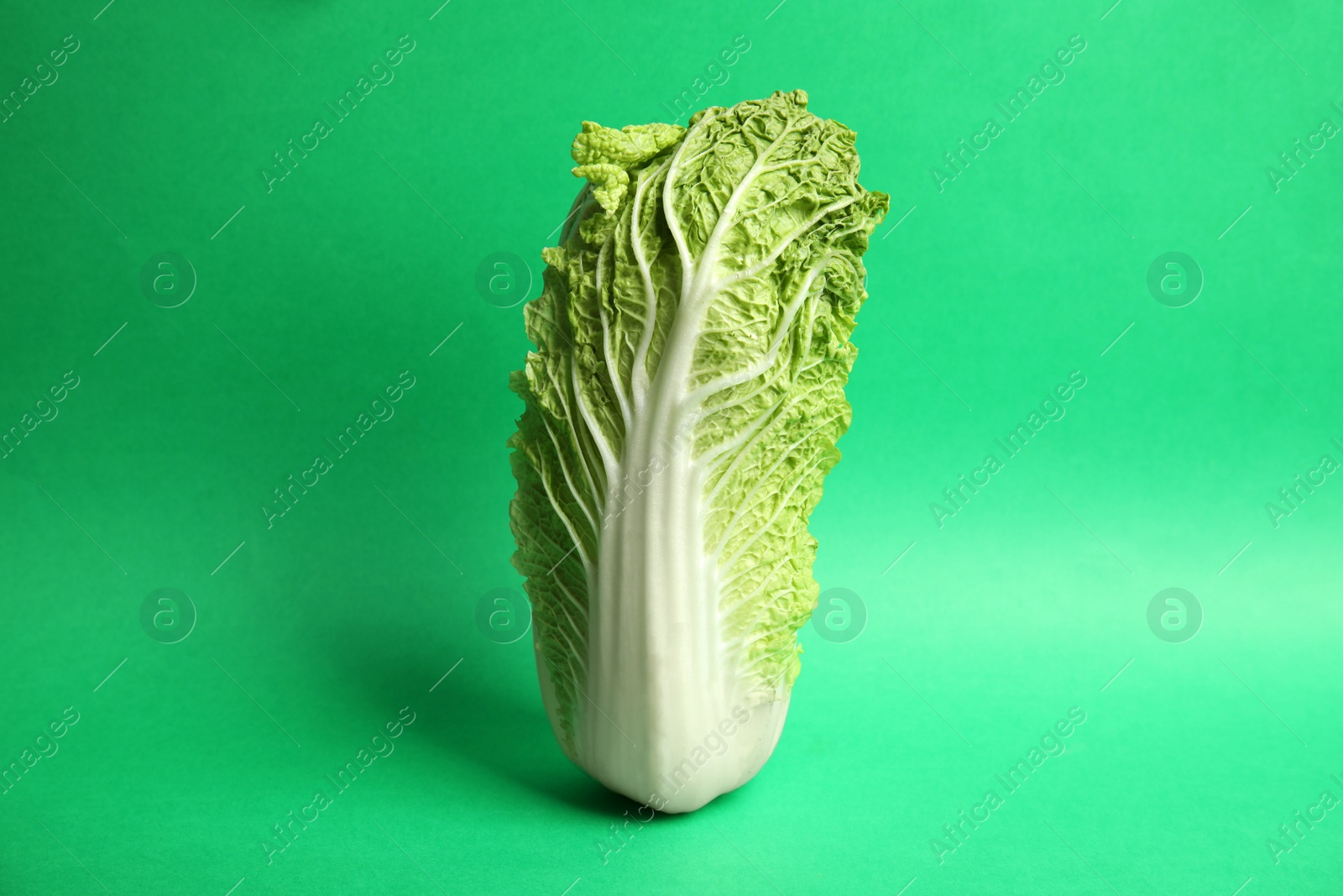 Photo of Fresh ripe cabbage on color background