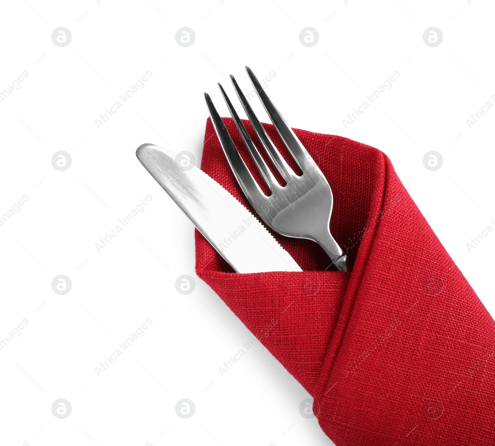 Photo of Fork and knife wrapped in red napkin on white background, top view