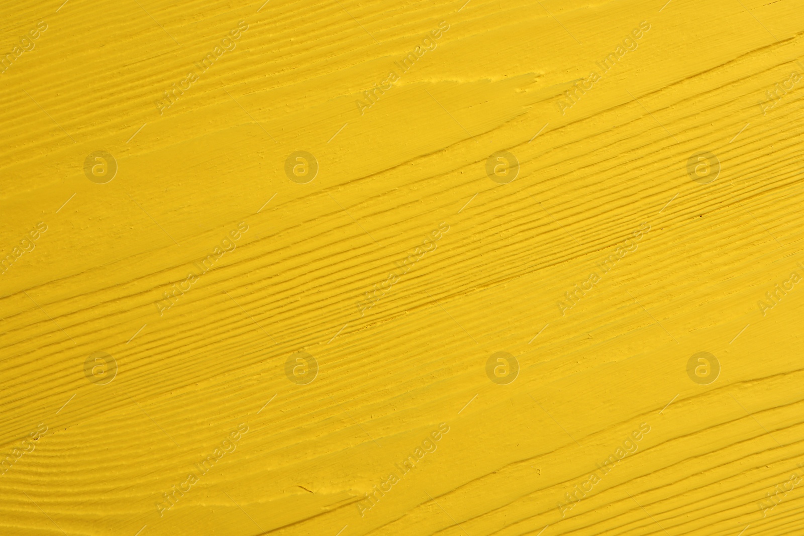 Photo of Texture of yellow wooden surface as background, closeup