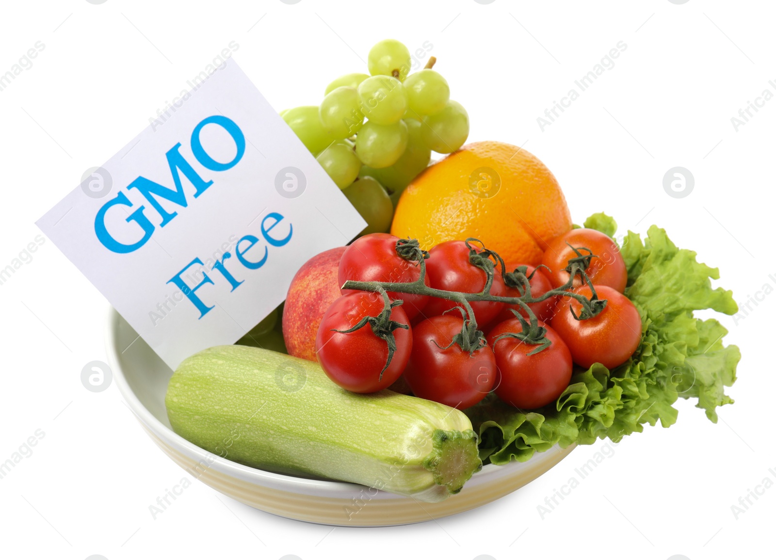 Photo of Fresh fruits, vegetables and card with text GMO Free in bowl on white background